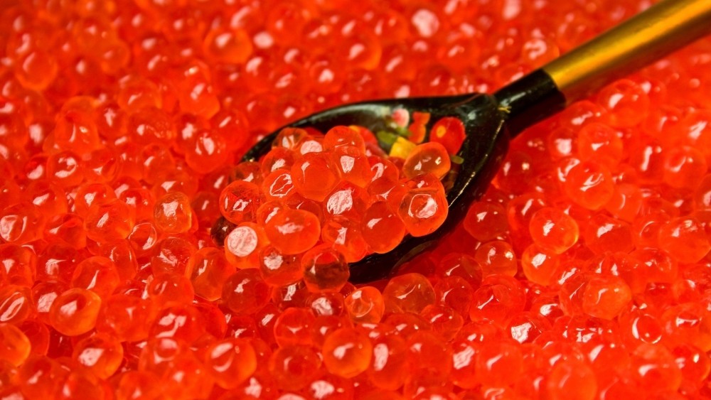 A face mask with red caviar