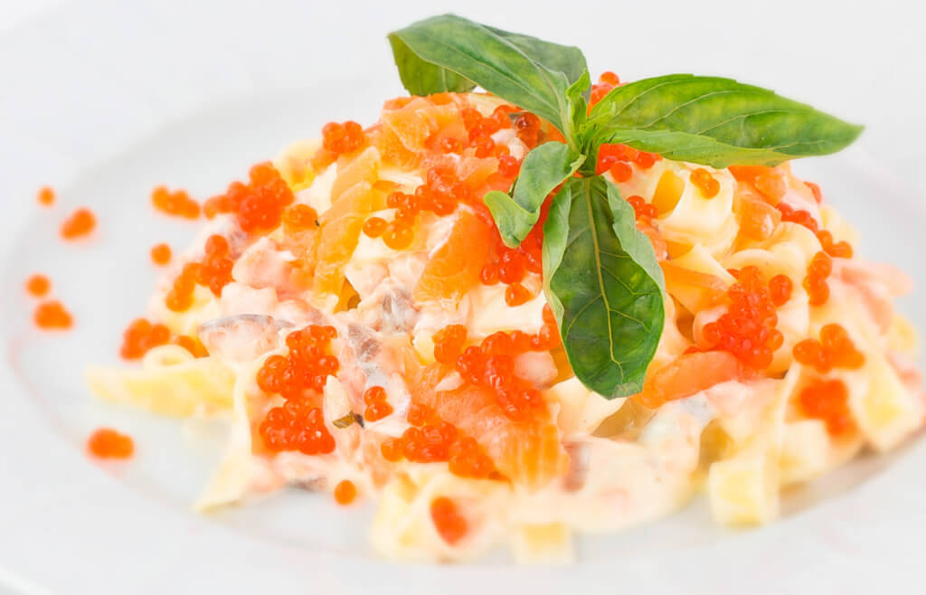 Salad with red caviar and squid